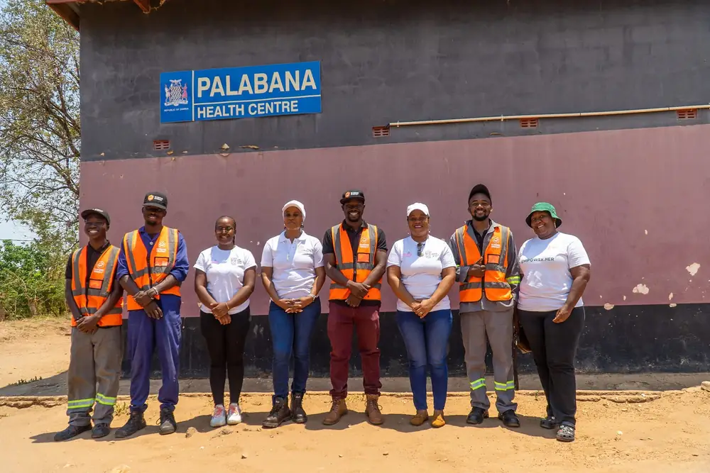 EcoHive technicians and partners outside Palabana Health Centre